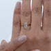 oval cut lab diamond hidden halo bezel set engagement ring on model's hand