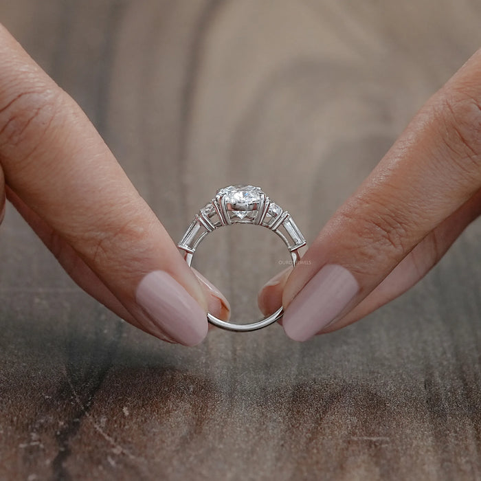 close view of oval and half moon cut diamond five stone engagement ring
