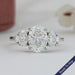 front view of oval and trillion cut lab diamond five stone engagement ring
