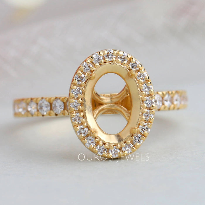 front view of oval-shaped round diamond halo semi-mount engagement ring