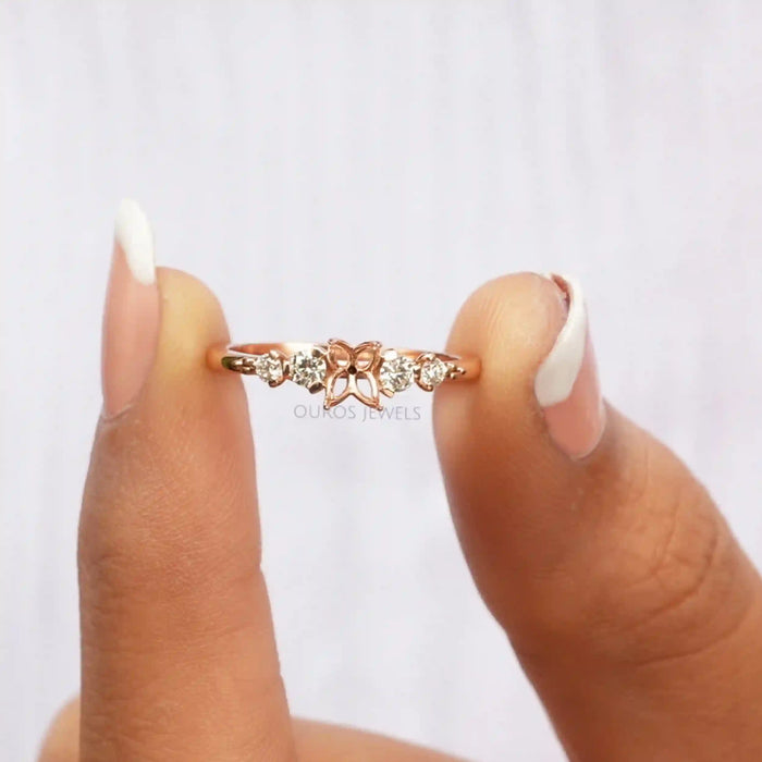 close view of flower-shaped semi-mount round diamond engagement ring