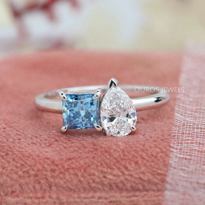 front view of blue princess-cut and pear lab diamond toi et moi wedding ring