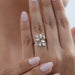 pear-cut lab-grown diamond leaf design cluster engagement ring in finger