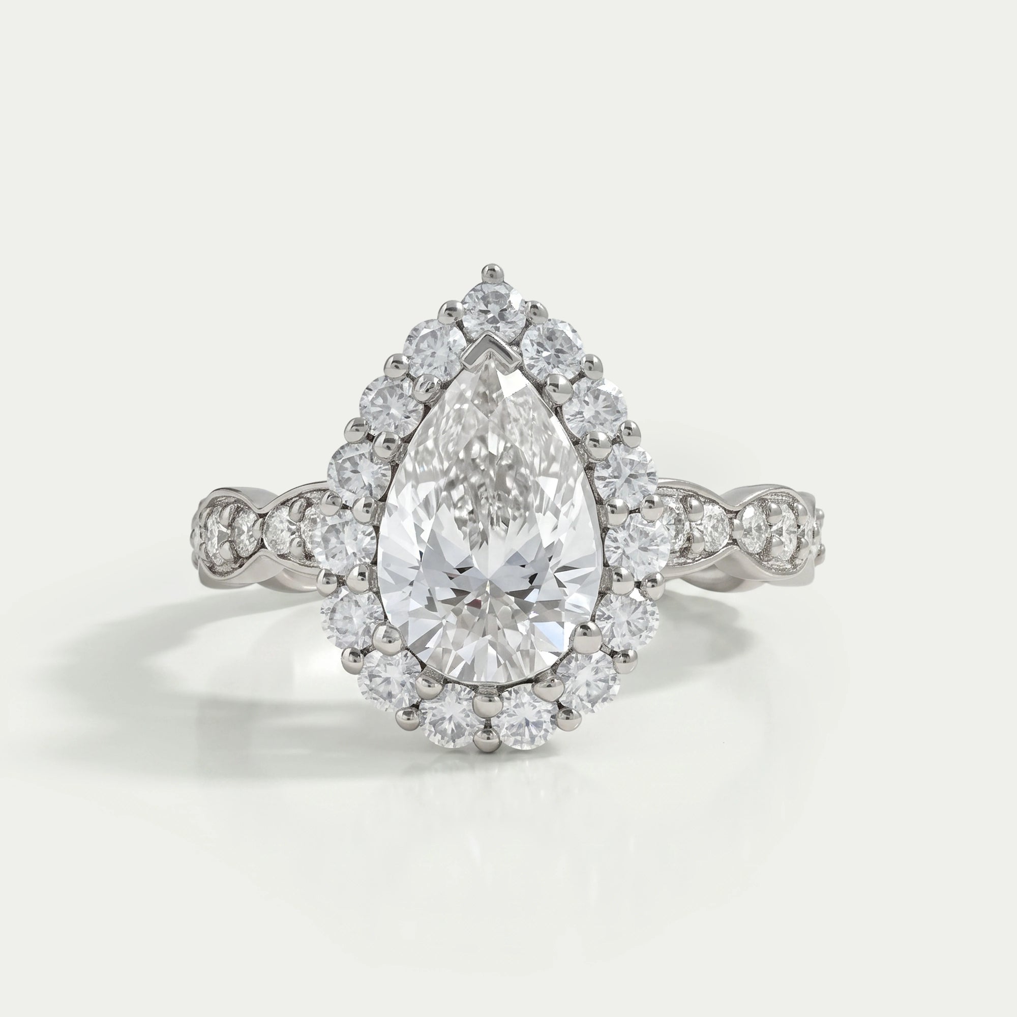 Pear Cut Accent Set Halo Engagement Ring