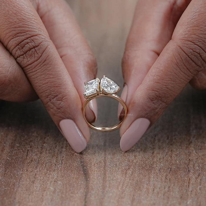 close view of pear and emerald cut lab diamond two-stone toi et moi engagement ring