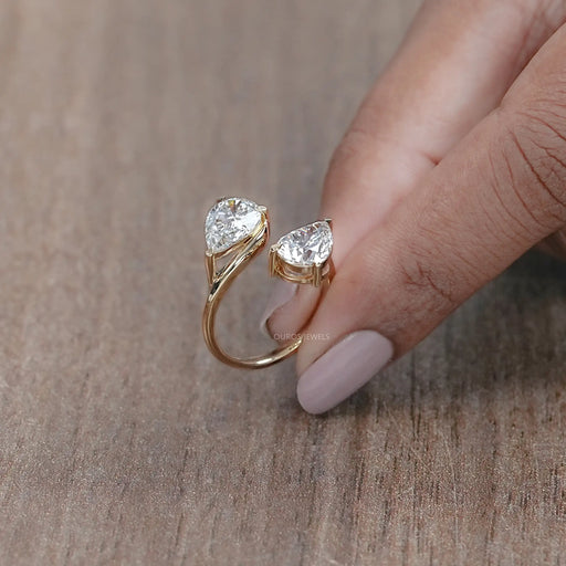 side view of pear-cut lab-grown diamond toi et moi engagement ring