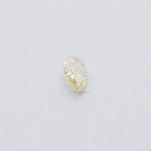 2.17 Carat Fancy Yellow Pear Cut Loose Diamond displayed on the soft plain white surface.