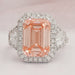 front view of pink emerald cut diamond three stone halo engagement ring