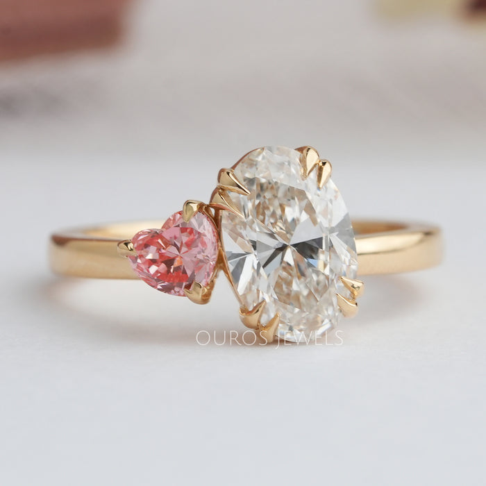 front view of oval and pink heart-cut lab-grown diamond toi et moi engagement ring