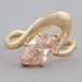 front view of pink marquise cut diamond bypass engagement ring in yellow gold