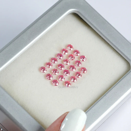 pink round shaped lab grown loose diamonds on box