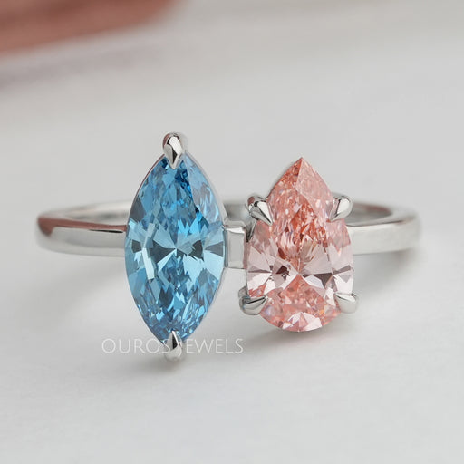 front view of blue marquise and pink pear lab diamond toi et moi engagement ring