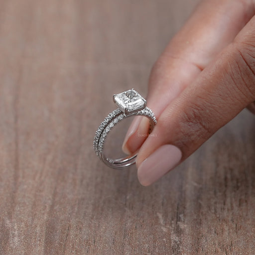side view of square radiant-cut diamond solitaire bridal ring set on brown background