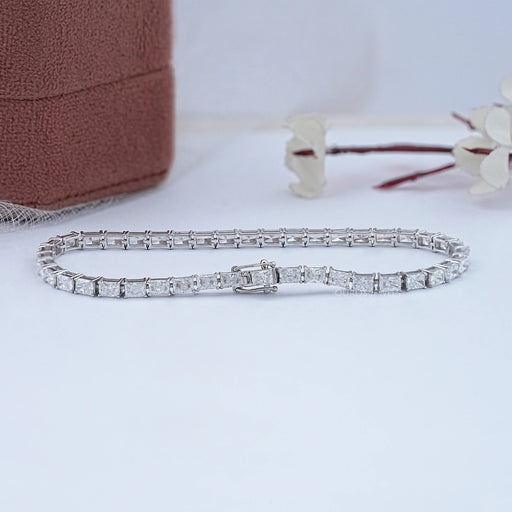 back view, east west set radiant cut man made diamonds tennis bracelet in white gold