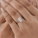 radiant cut diamond solitaire engagement ring on model's hand