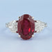 front view of oval ruby gemstone with heart diamond 3 stone engagement ring