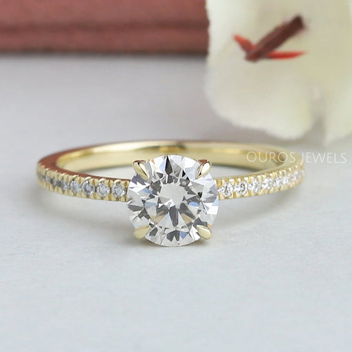 front view of round cut lab diamond solitaire hidden halo engagement ring yellow gold band