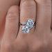 front view of round cut lab diamond toi et moi anniversary ring in finger