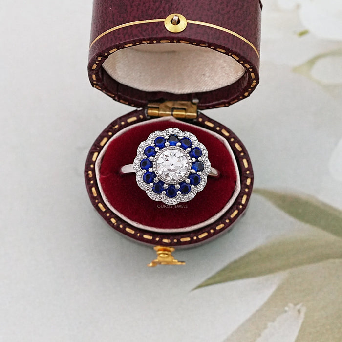 old european round cut diamond sapphire halo engagement ring in jewelry box