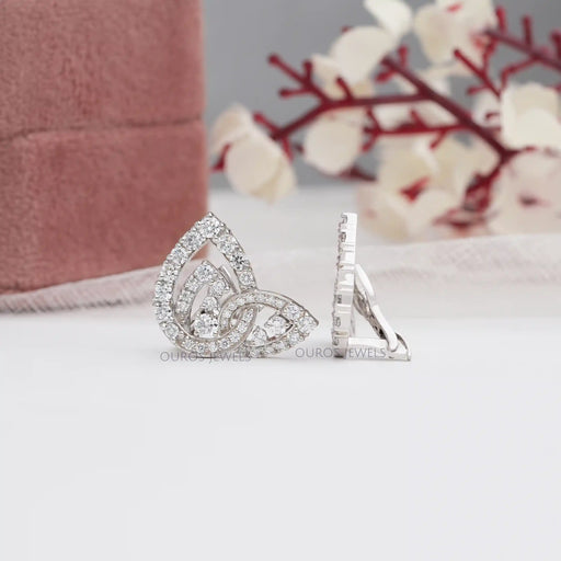 top and side view pear shaped round cluster diamond omega back earrings art deco
