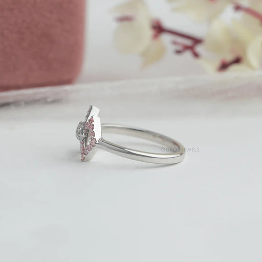 side view of round-cut lab-grown diamond classic wear bow ring pink on fabric