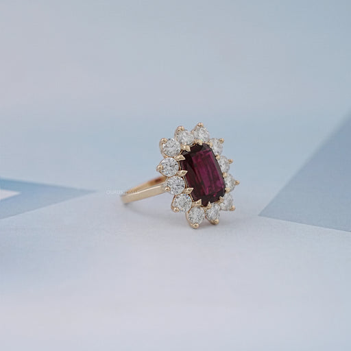 side view of ruby elongated cushion gemstone with round halo engagement ring