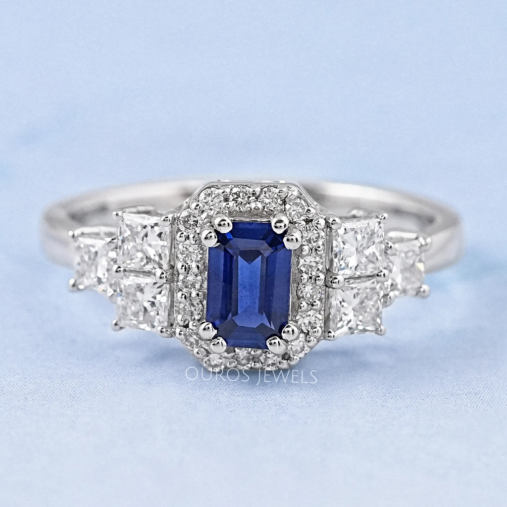 sapphire emerald diamond engagement ring with halo accent's front view
