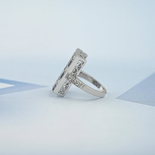 side view of sapphire and french cut lab diamond vintage engagement ring on fabric