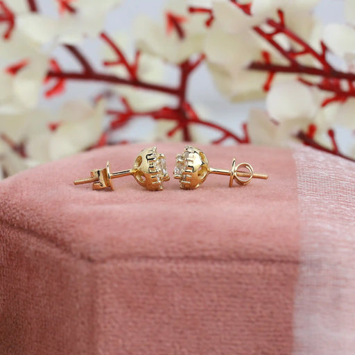 side view of round cut manufactured diamond screw back stud earrings in gold