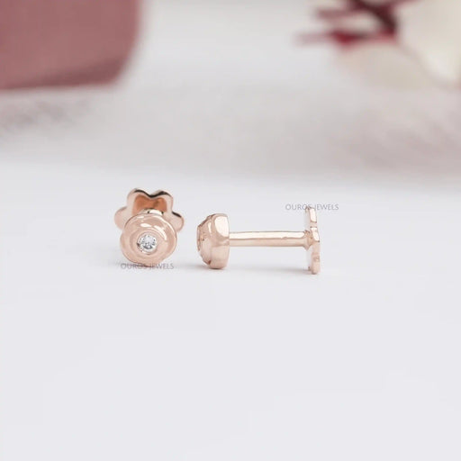 front and side view round cut diamond blushing rose infant earrings push back