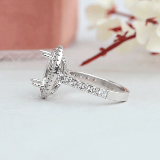 side view of oval semi-mount round diamond halo engagement ring