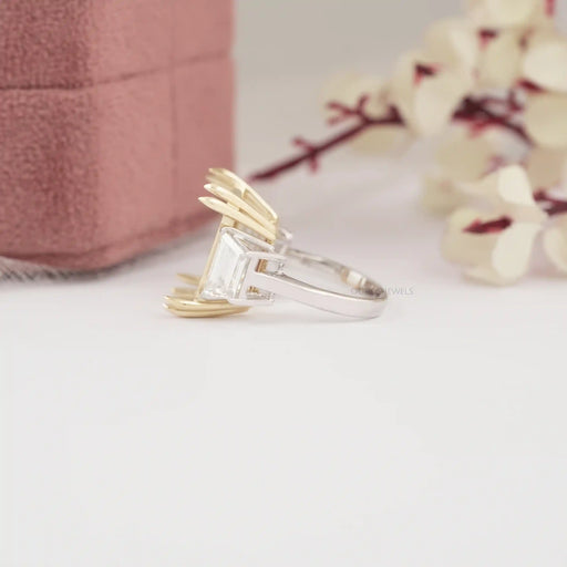 side view of step-cut trapezoid semi-mount three-stone wedding ring on fabric