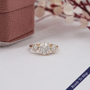 three stone engagement ring yellow gold 