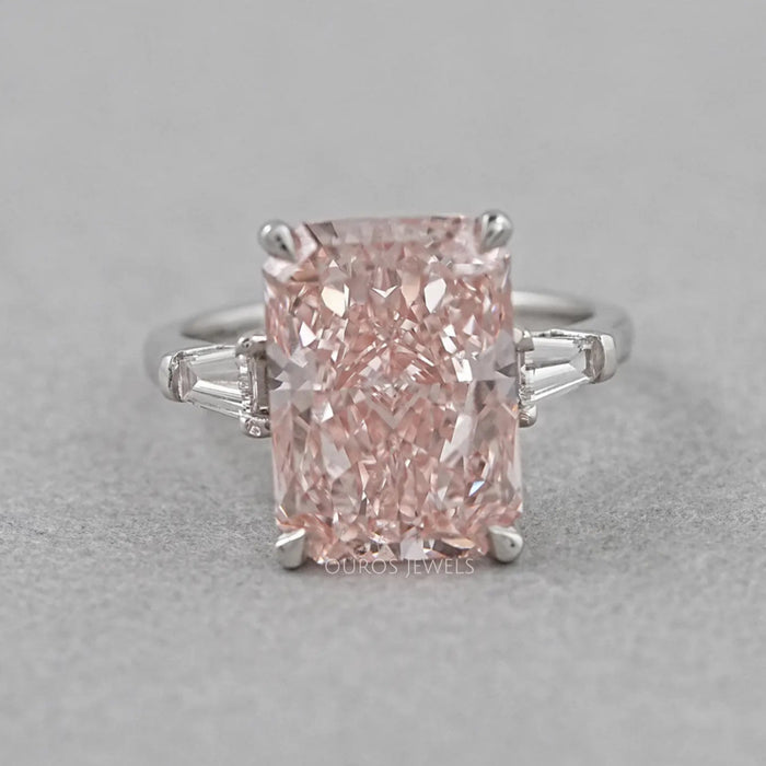 front view of pink radiant-cut lab diamond three-stone colored engagement ring