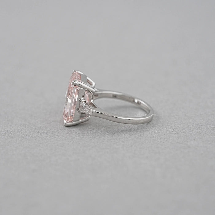 side view of pink radiant-cut lab diamond three-stone colored engagement ring