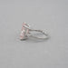 side view of pink radiant-cut lab diamond three-stone colored engagement ring