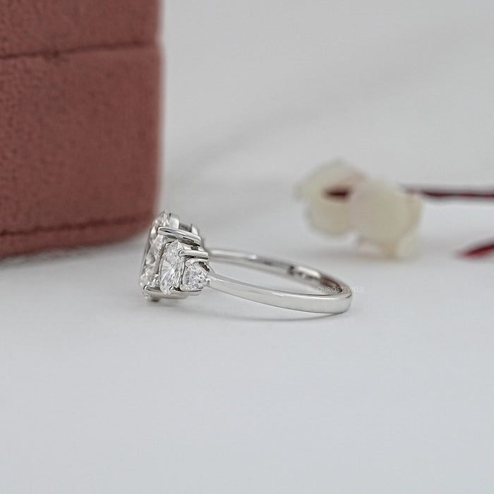 side view of oval and trillion cut lab diamond five stone engagement ring