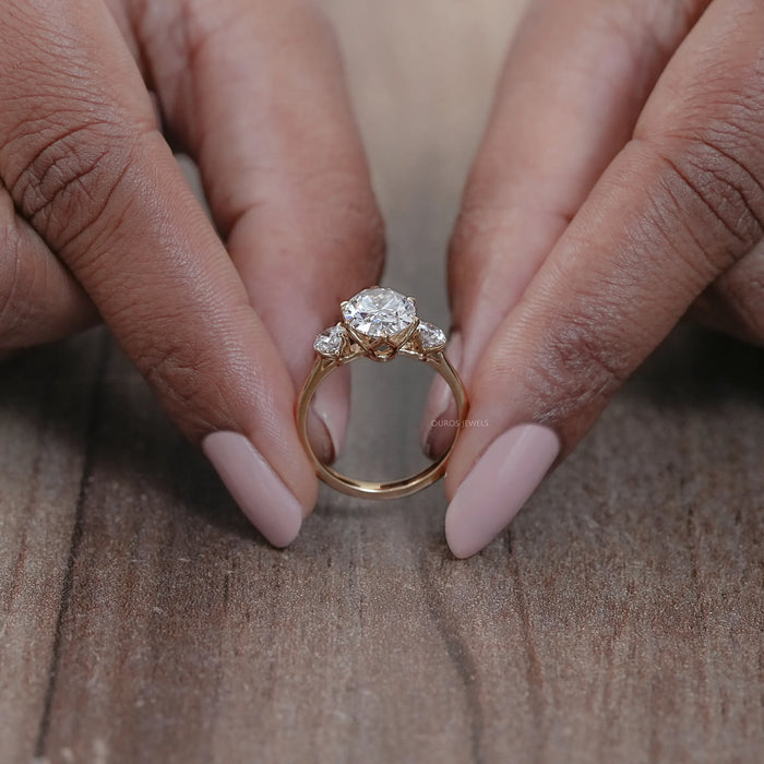 close view of oval cut lab made diamond three stone engagement ring