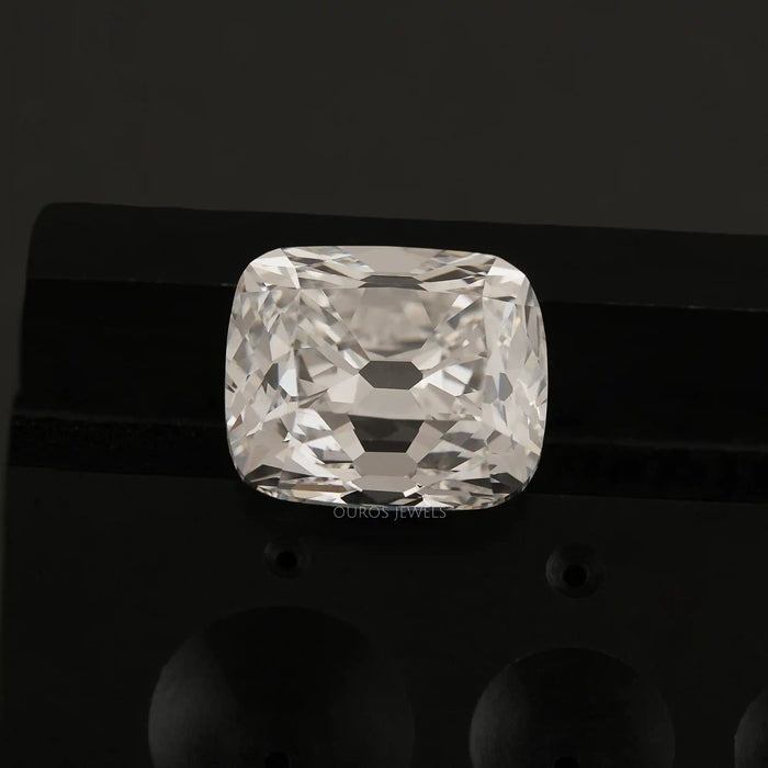 10 Carat IGI Certified Old Mine Cushion Cut Diamond showcased on a black stand.