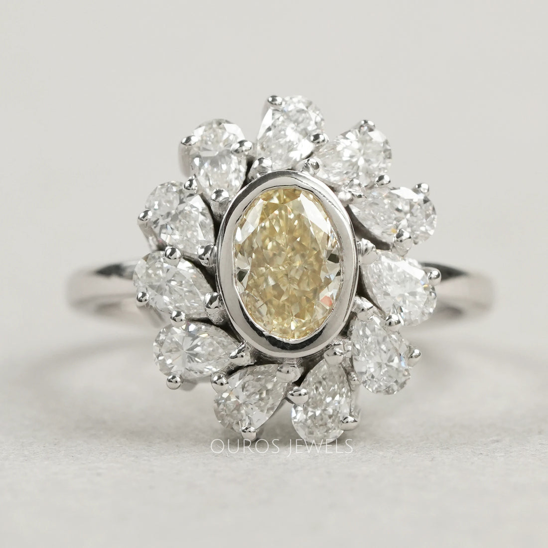 Yellow Oval Bezel Set Diamond With Pear Halo Ring
