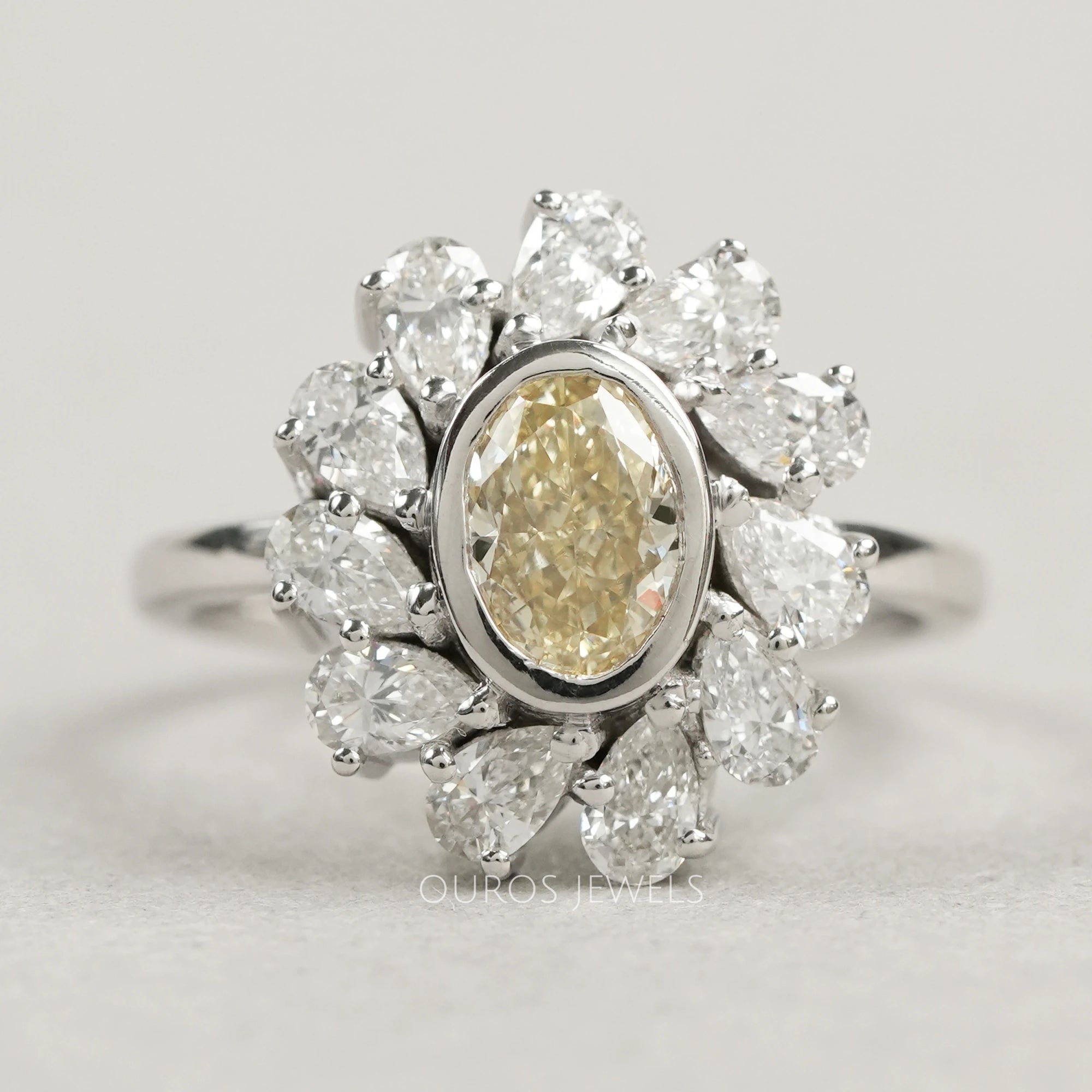 Yellow Oval Bezel Set Diamond With Pear Halo Ring
