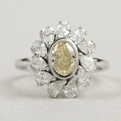 Yellow Oval Bezel Set Diamond With Pear Halo Ring