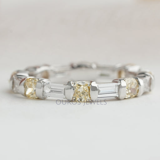 front view of yellow cushion and baguette lab grown diamond eternity wedding band