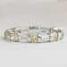 front view of yellow cushion and baguette lab grown diamond eternity wedding band