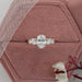 oval and round cut lab diamond five stone engagement ring in jewelry box