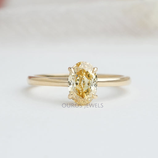 front view of yellow oval cut lab diamond engagement ring