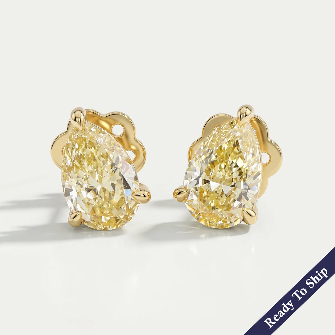 Yellow Pear Diamond Solitaire Stud Earrings