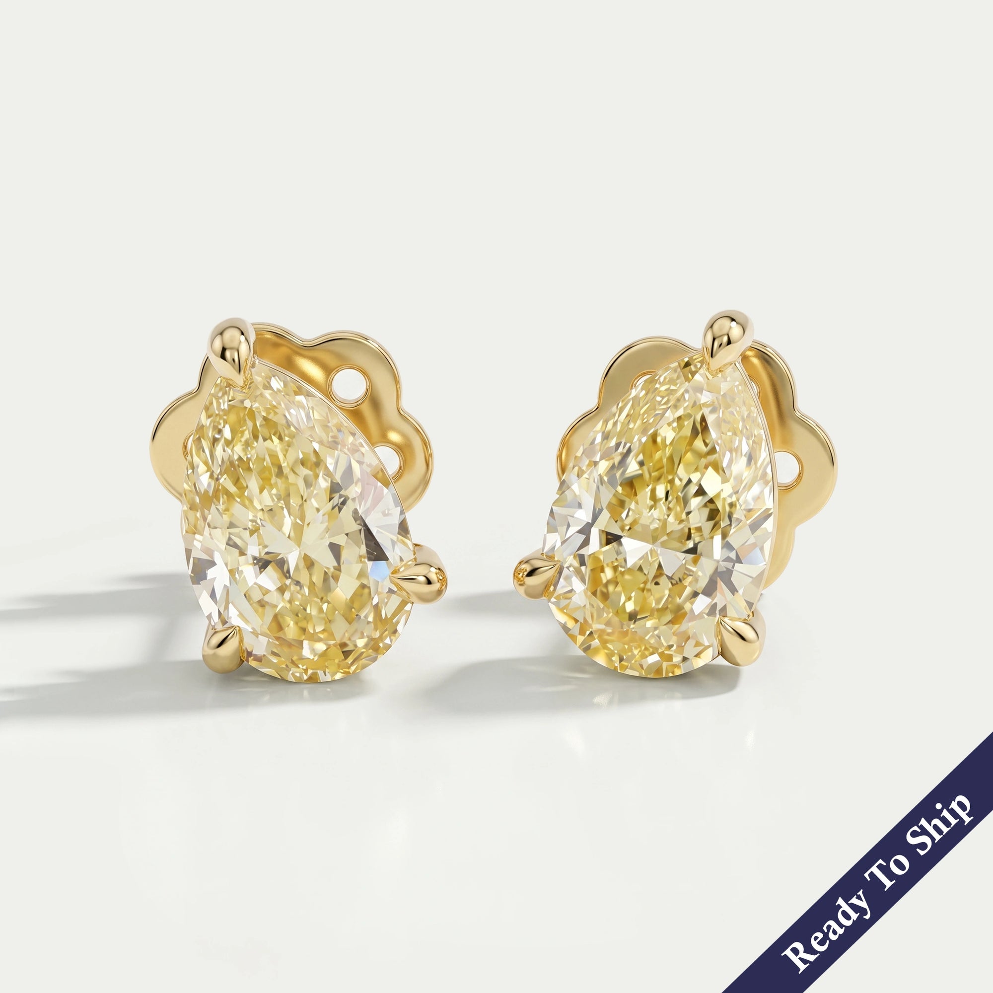 Yellow Pear Diamond Solitaire Stud Earrings