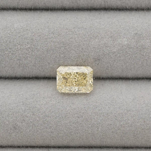 2.15 Carat Fancy Intense Yellow Radiant Cut Lab Diamond displayed on a grey velvet jewelry tray.