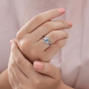 [On Finger View Of Blue Pear Cut With Round Cut Lab Diamond Halo Engagement Ring]-[Ouros Jewels]